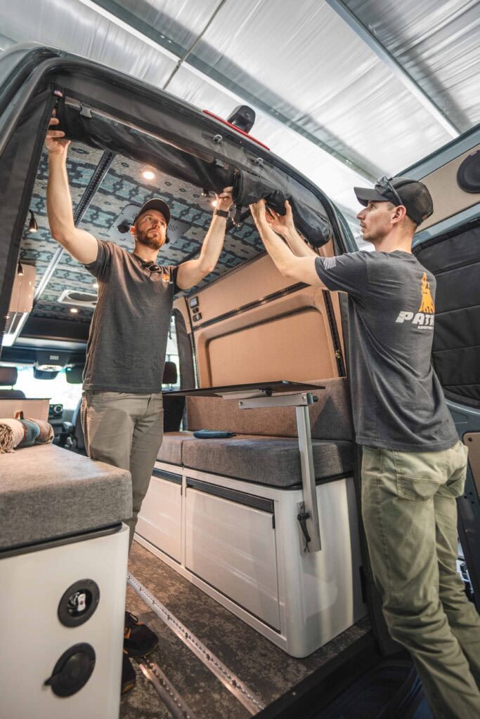 High-quality police patrol vehicle interior with officers installing roof storage.