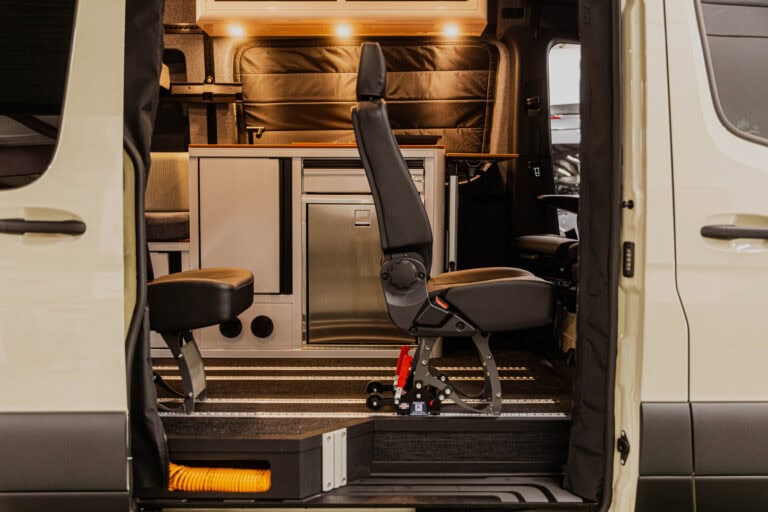 Patrol van interior with mobile workstation and wheelchair lift for accessible police vehicle. - Patrol Vans High-quality image of a patrol van showing custom interior with a workstation and accessible wheelchair lift.