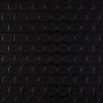 Close-up of black foam soundproofing material in patrol vehicle compartments. Perfect for vehicle noise insulation and acoustic treatment.