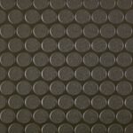 Close-up of black foam cylindrical padding surface used for vehicle soundproofing or insulation.